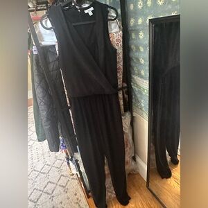 Black romper Bar III size XS. Zip back. V over tank One button accent at neck.